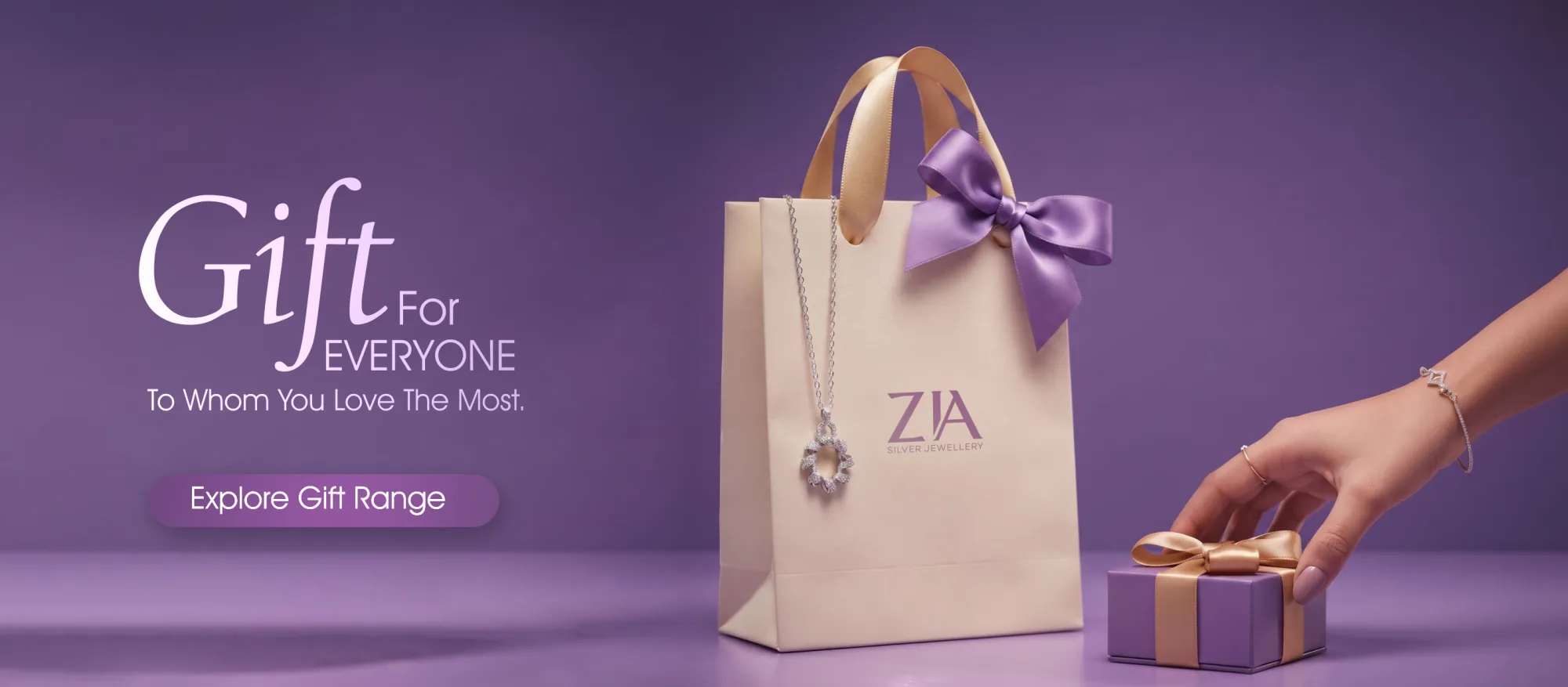 A ZIA gift bag with a 925 sterling silver pendant and a wrapped gift box. Explore the gift range.